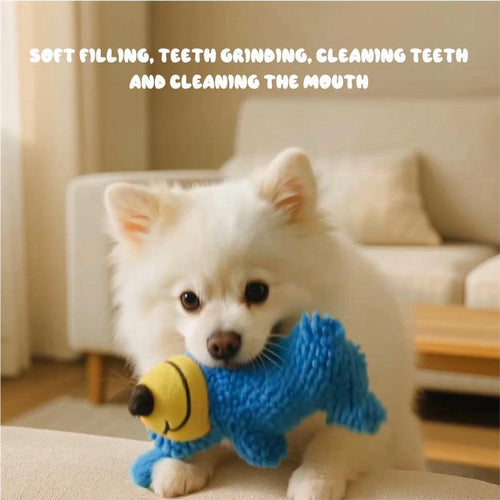 Fluffy white dog chewing on the blue chenille screaming plush dog toy indoors